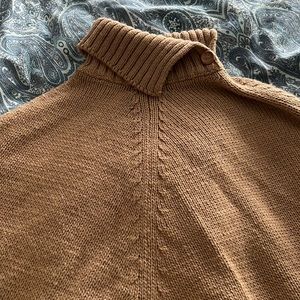 Lord and Taylor knit poncho with button and turtle neck collar.